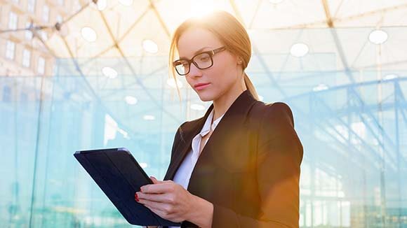 woman-in-suit-with-ipad