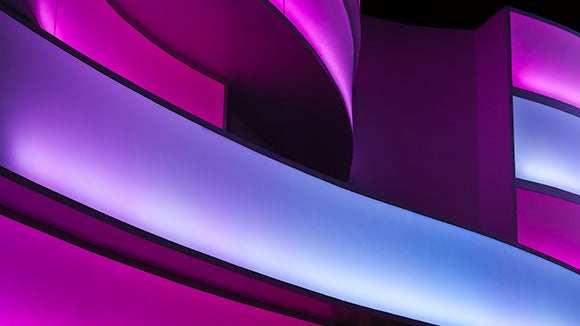 purple swirly background of image of building up close