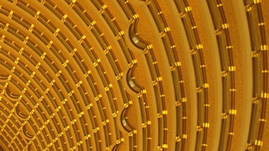 Partial look of a circular tunnel wall in gold color,  view from below  
