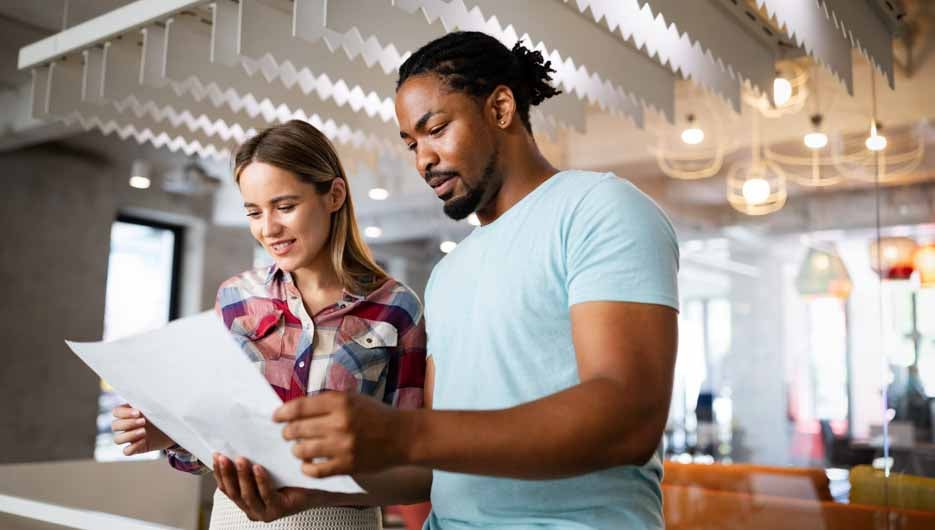 Successful group of designers, business people at work in office